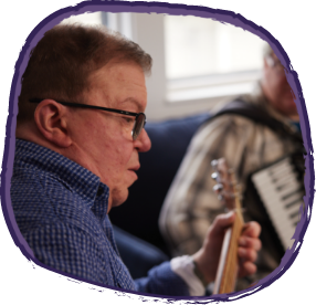 Hunter syndrome patient playing a guitar